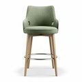 Chaise de bar en bois clair avec revêtement en tissu vert et dimensions 45 x 50 x 100cm
